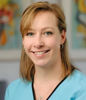 Brooke, Dietrich Family Orthodontics treatment coordinator, smiling professionally.