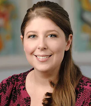 Brooke, Dietrich Family Orthodontics treatment coordinator, smiling professionally.