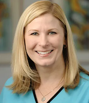 Brooke, Dietrich Family Orthodontics treatment coordinator, smiling professionally.